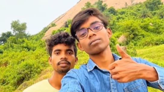 “Founder of Shuddh Swad holding traditional thekua in a home kitchen, representing his journey from a ₹10,000 start to a ₹1 crore food startup.”